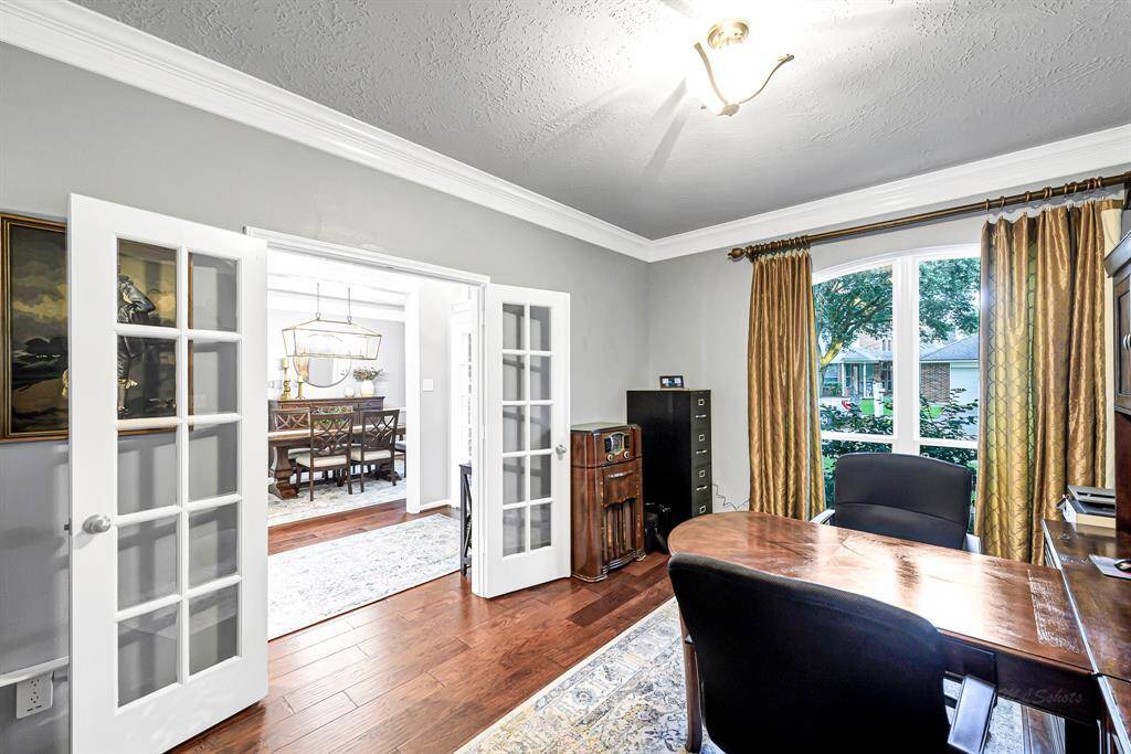 FRENCH DOORS ELEVATE THIS SPACIOUS STUDY