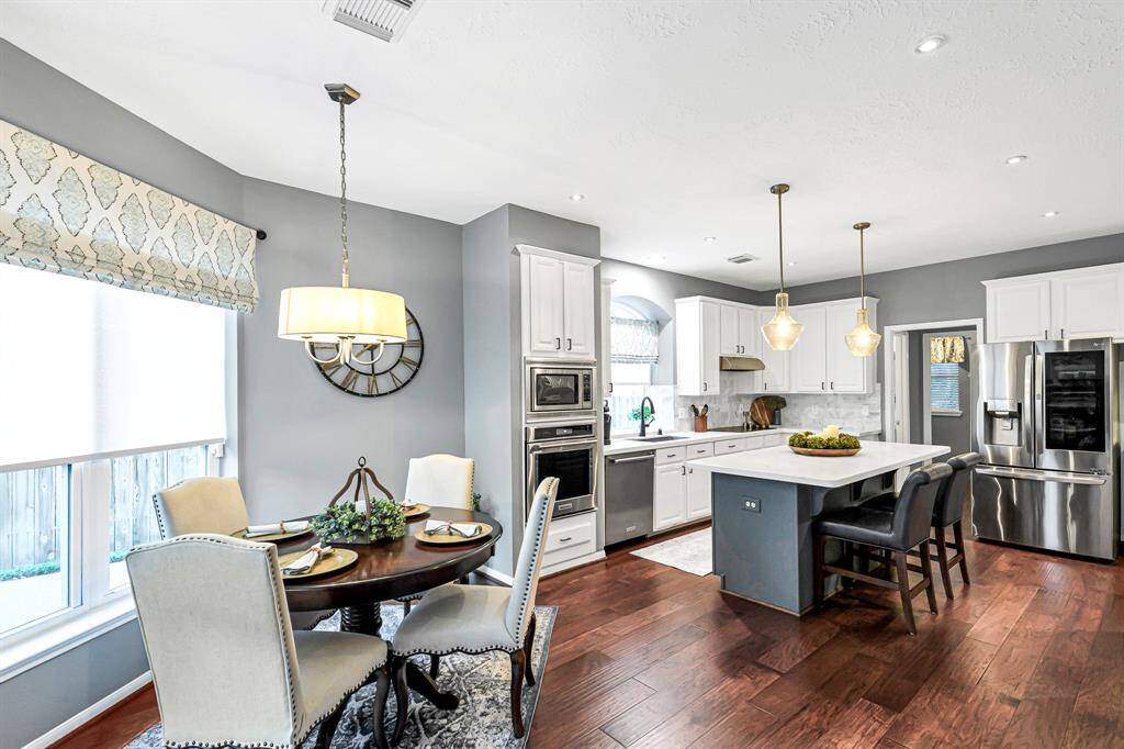 STAINLESS STEEL APPLIANCES IN THIS RECENTLY REMODELED KITCHEN