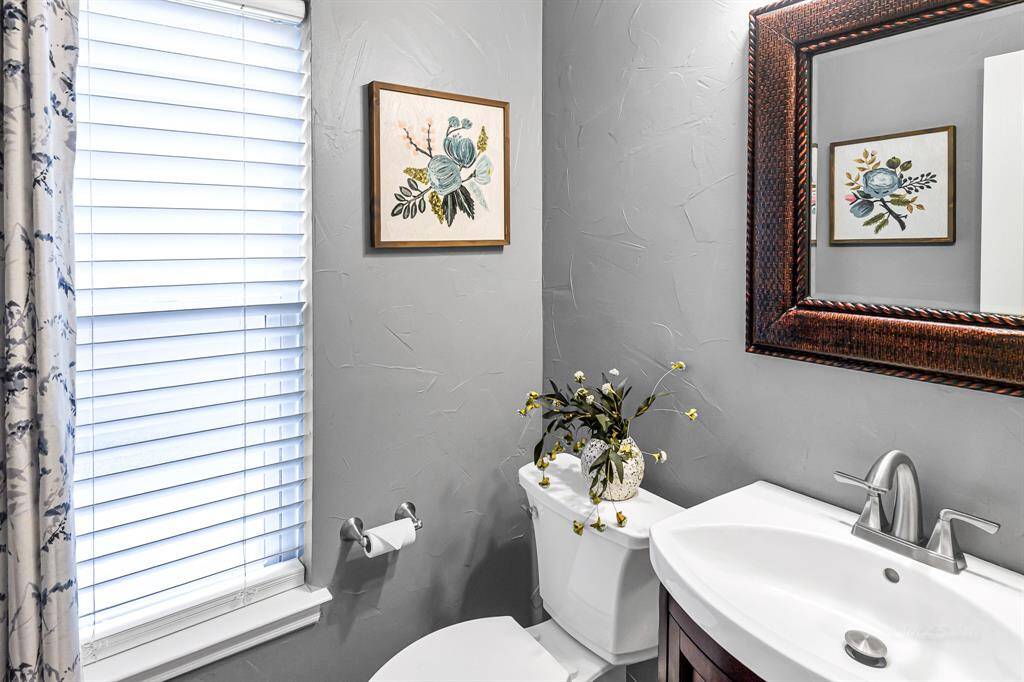 TASTEFULLY REMODELED HALF BATH DOWN