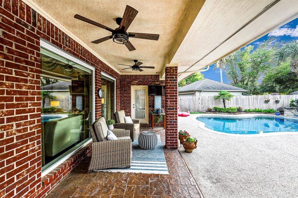 LARGE COVERED PATIO WITH TILE FLOORING FOR THOSE SUMMER NIGHT COOKOUTS