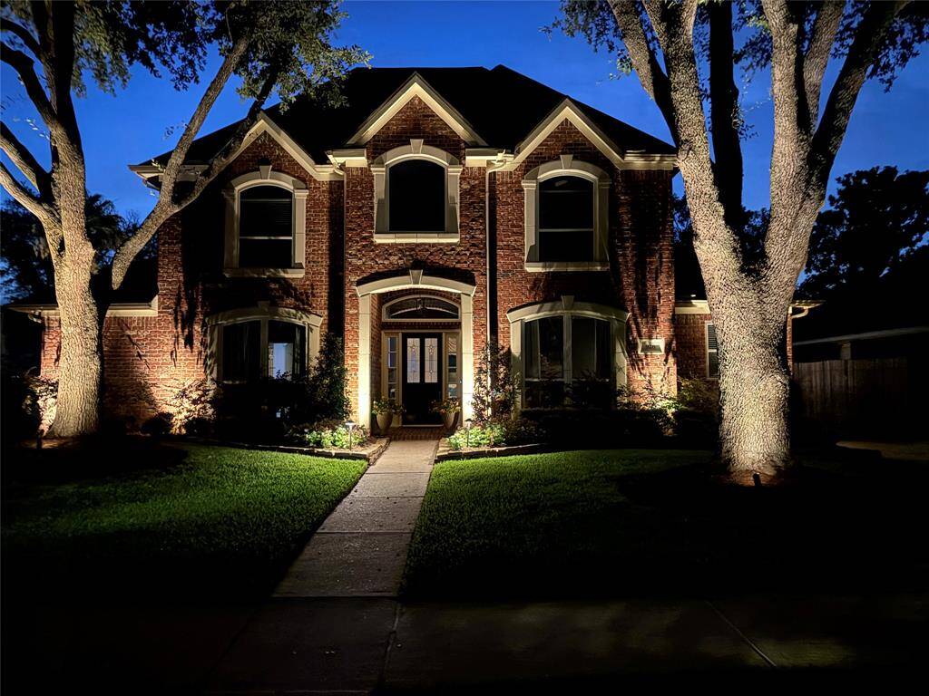 NIGHTIME LANDSCAPE LIGHTING HIGHLIGHT THIS BEAUTIFUL UPGRADED ELEVATION