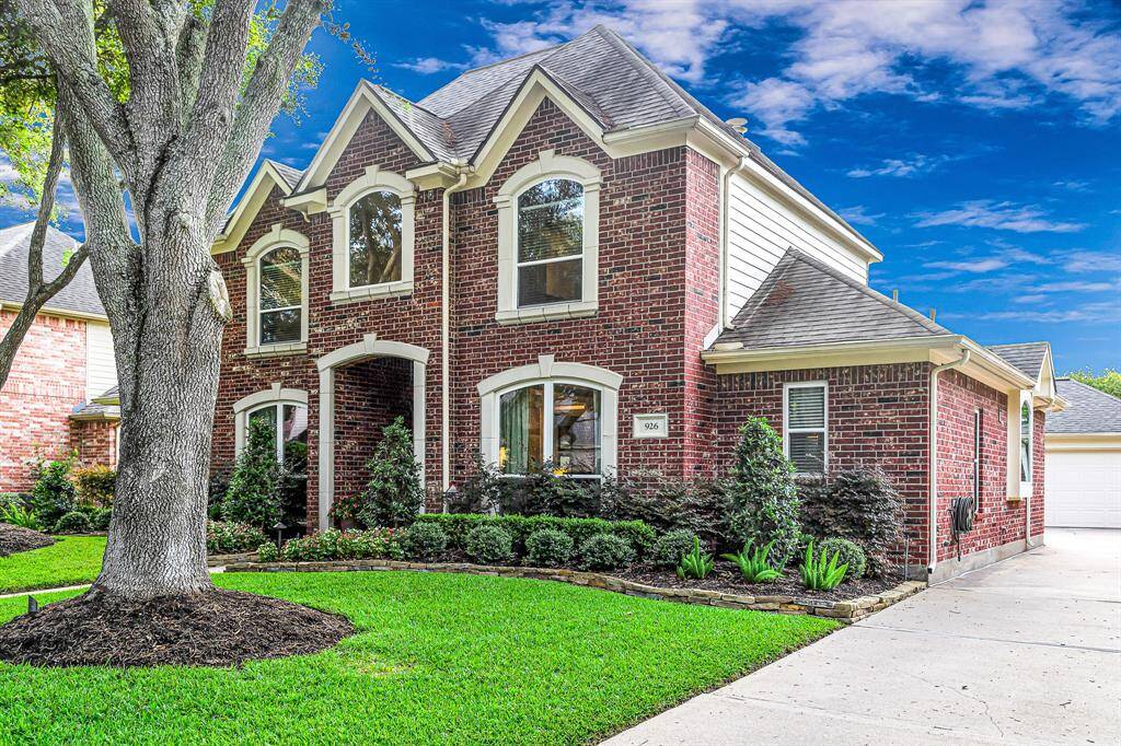 WIDE DRIVEWAY TO AN EXTRA SPACIOUS DETACHED OVERSIZED GARAGE