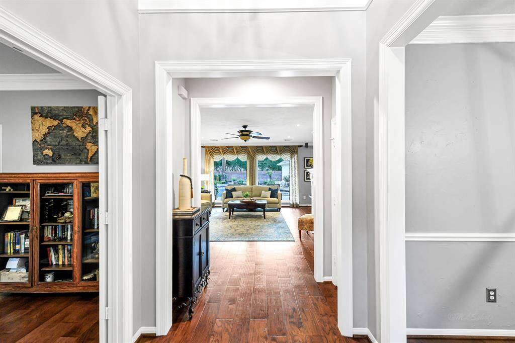 AS YOU ENTER THE FOYER, THE SPACIOUS STUDY WITH FRENCH DOORS IS ON LEFT WITH FORMAL DINING ROOM ON RIGHT