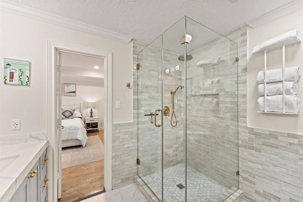 Rain shower with separate hand shower. Gorgeous designer tile.