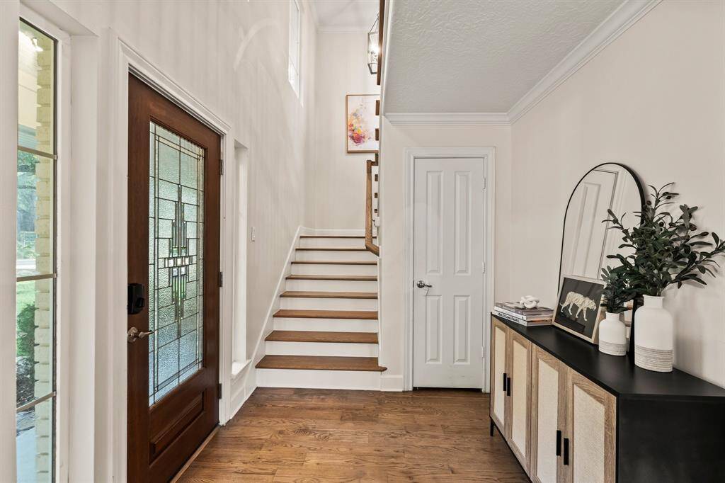 Vaulted ceiling with hard wood steps leads to second story landing, den, and two extra bedrooms.