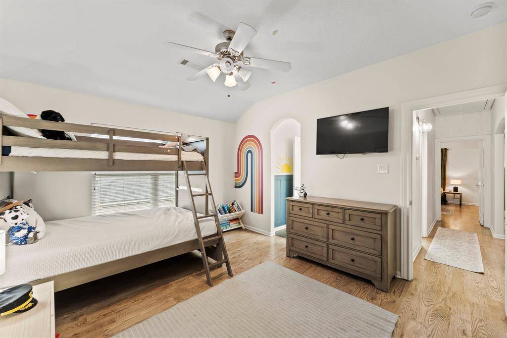 Bedroom 4 with hardwood flooring.