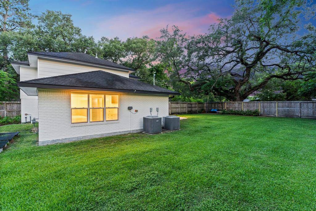 Northeast corner of backyard, plenty of room on eastern side of yard for dog run, solar panels, or a garden, just out of view.