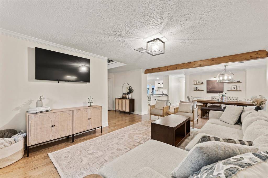 Perfect living-room space captured from southeast corner of home.  Window just out of view shaded by stately oaks.
