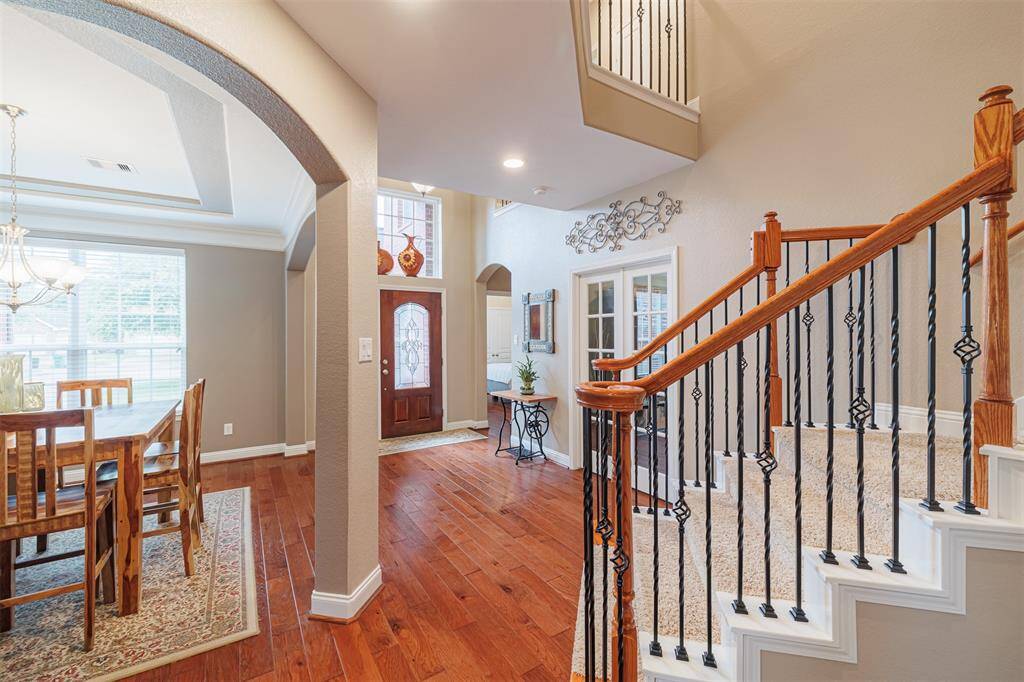 Entry leads to the formal dining and study. Staircase features wrought iron spindles.
