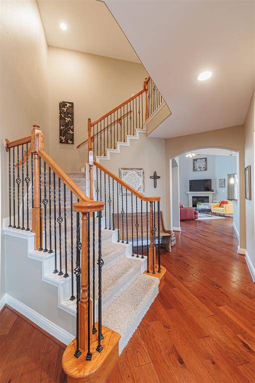 Staircase with wrought iron spindles.