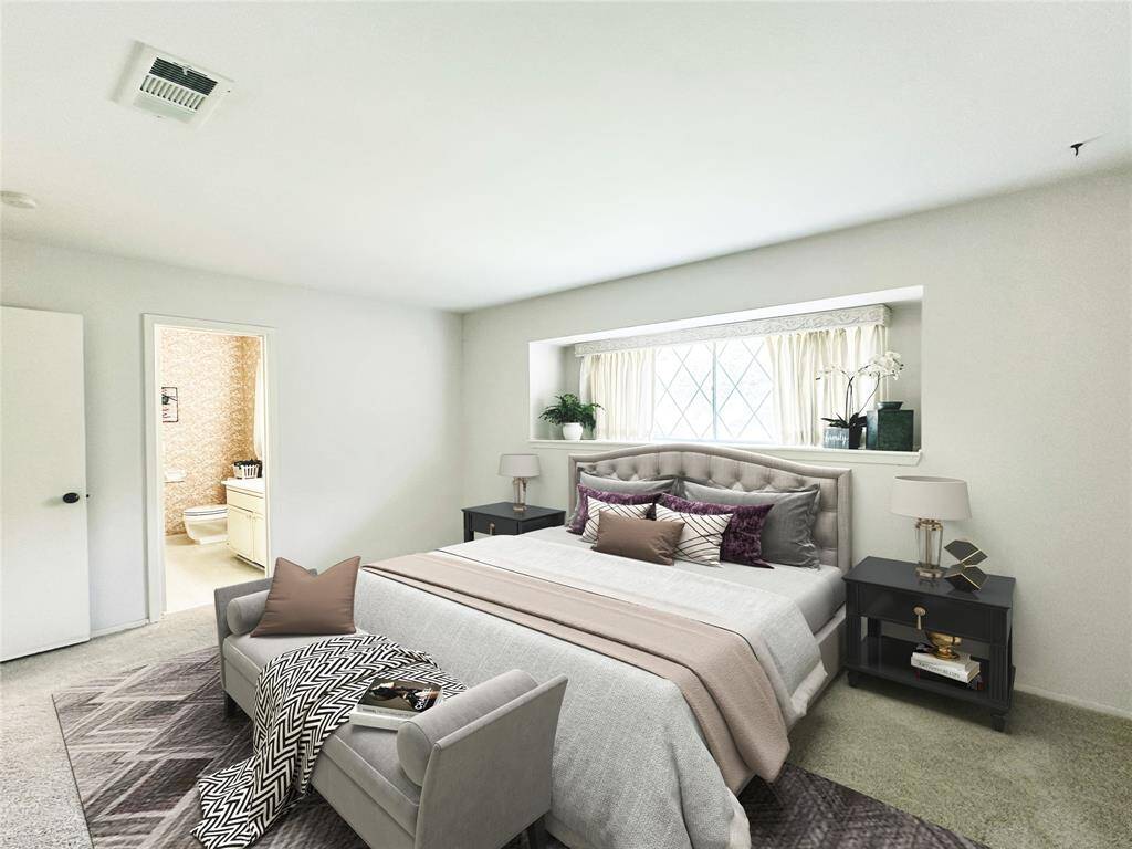 Primary Bedroom has fresh carpet.  A large window with display shelf offers lots of natural light.  A closet encompasses the entire wall with 2 doors for entry and easy access. Image is Virtually Staged.