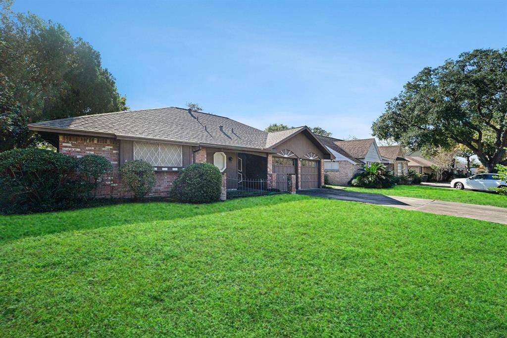 This charming single-story brick home has a 2-car garage, Updated Roof in Fall 2023, a welcoming front entrance, a large front yard and is located in desirable Westchase
