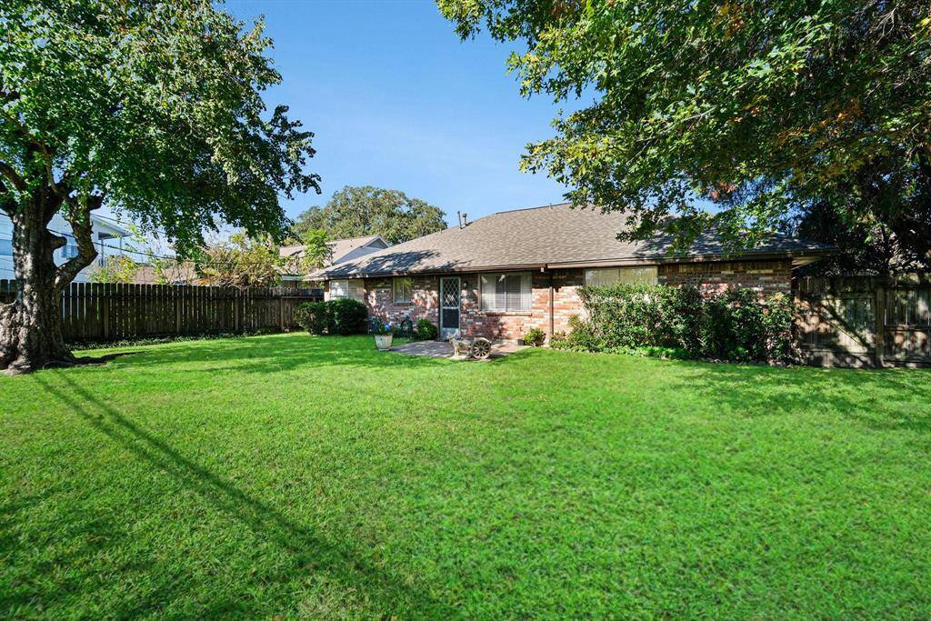 Huge Backyard with Mature Trees, a storage shed and a patio area.