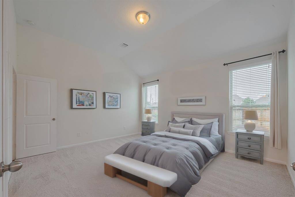 Bedroom is virtually staged.