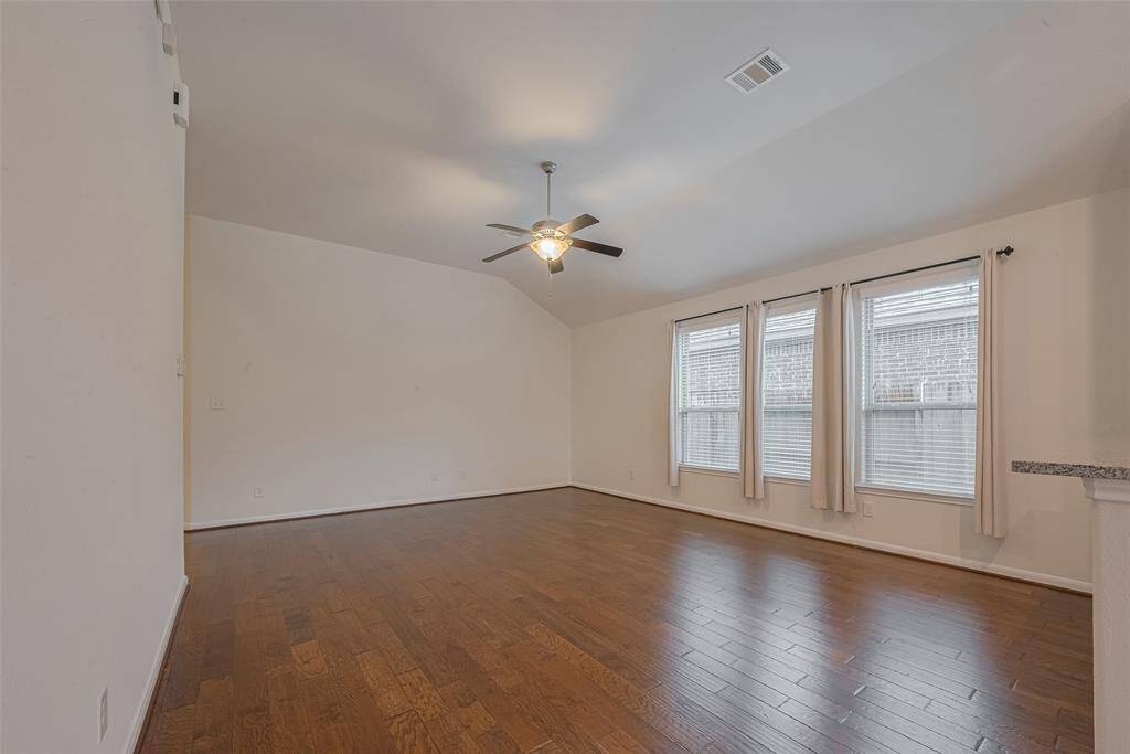 The distressed hardwood flooring flows throughout the main living areas of the home.