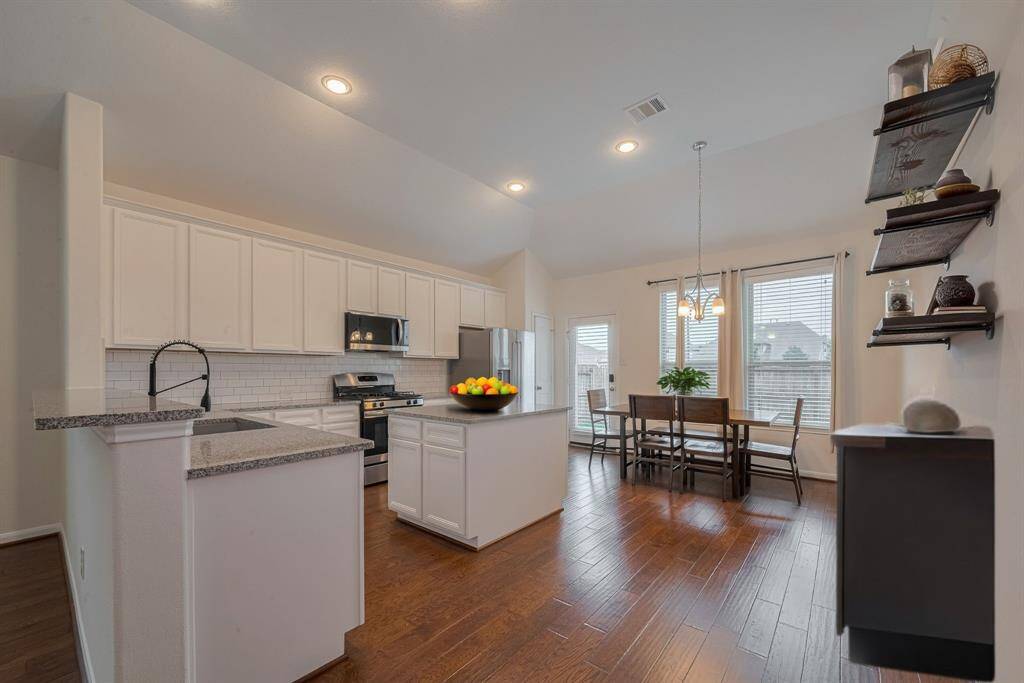 Kitchen is virtually staged.