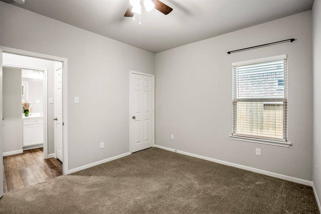 It’s bigger on the inside! This third bedroom keeps it classic at first glance, but behind that door is a walk-in closet worthy of its own zip code. And just outside, a bonus hall closet adds even more storage magic. Upgraded fan overhead, cozy carpet underfoot, and plenty of room to personalize.