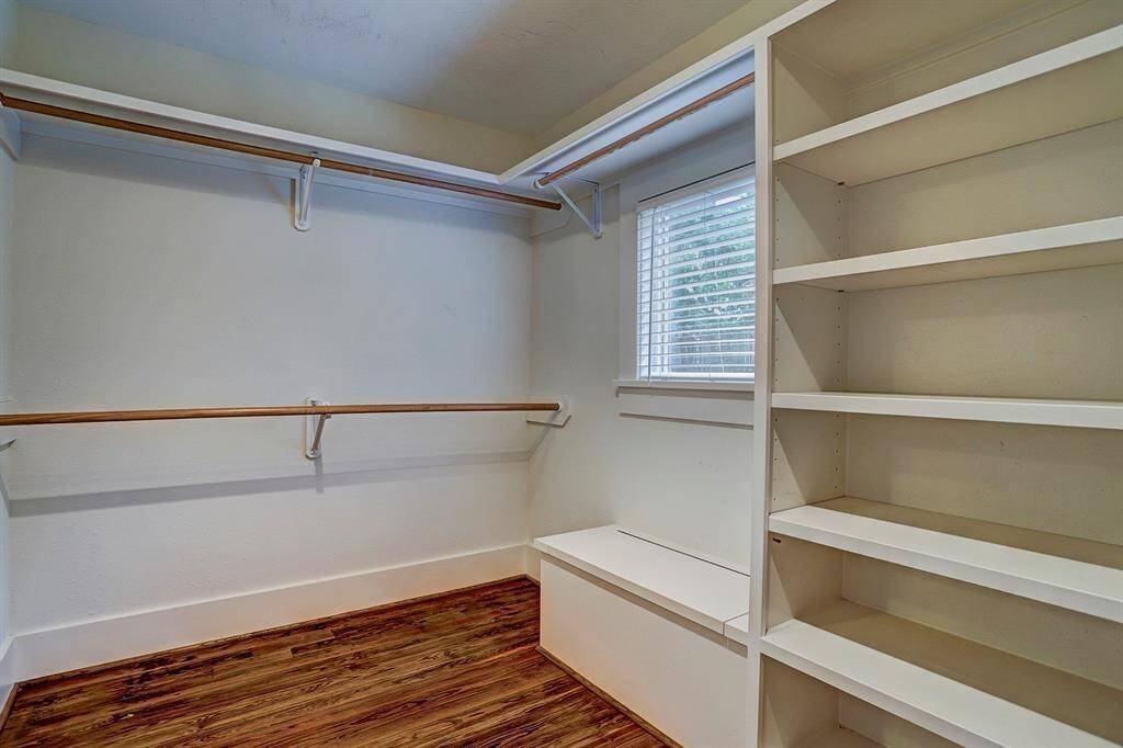 [Bedroom 1 - walk-in closet] The generously sized closet offers plenty of room, both hanging and shelving.