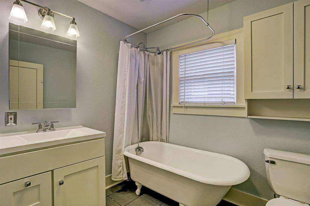 [Bathroom 2] Off the kitchen you will find the 2nd full bathroom, great for guests or a roommate setup.