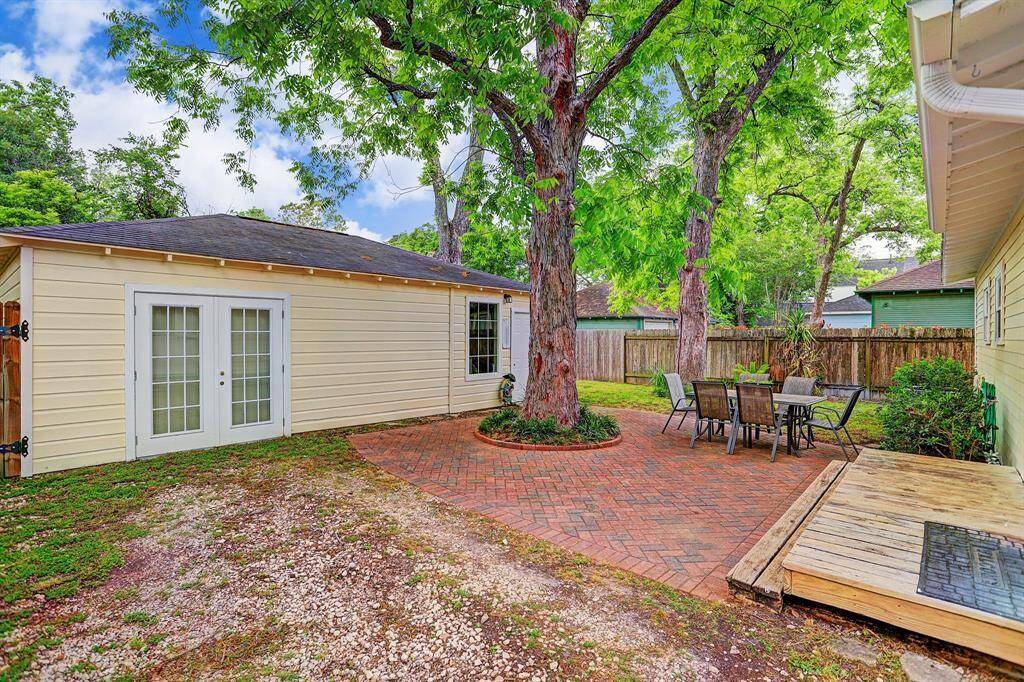 [Backyard] Enjoy both a yard and this lovely papered patio.