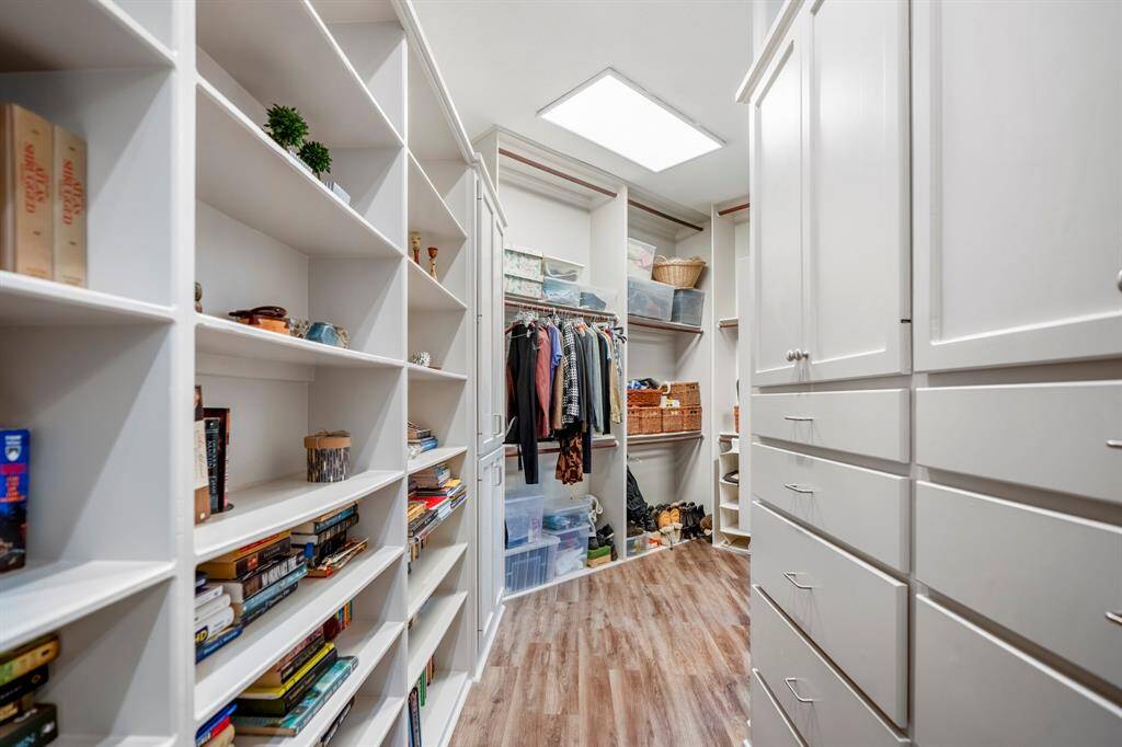 Talk about a "Texas Sized Closet"  this is a glimpse, as you round the corner you will be amazed at the space - there is even a wall mounted ironing board!