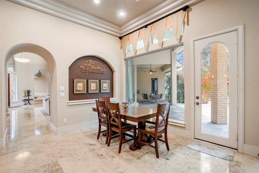 The breakfast room is the perfect place to start your day or enjoy any meal of the day, with access to the lanai and summer kitchen just steps away.