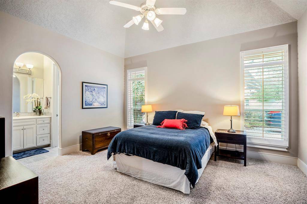 Another spacious secondary bedroom, offering ample room for furnishings and a soothing sense of open space.
