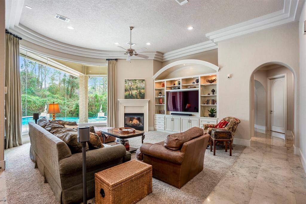 The family room might be where you spend most of your days with the built-in entertainment center, fireplace and stunning views to the backyard and beyond.