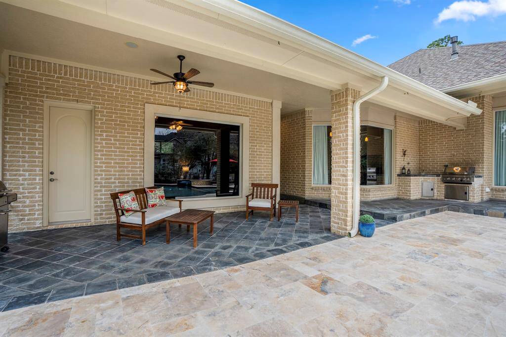The floor to ceiling windows in the casita/ fourth bedroom offers picturesque views of the pool, blending indoor elegance with outdoor relaxation. Pool bath is easily accessible, too!