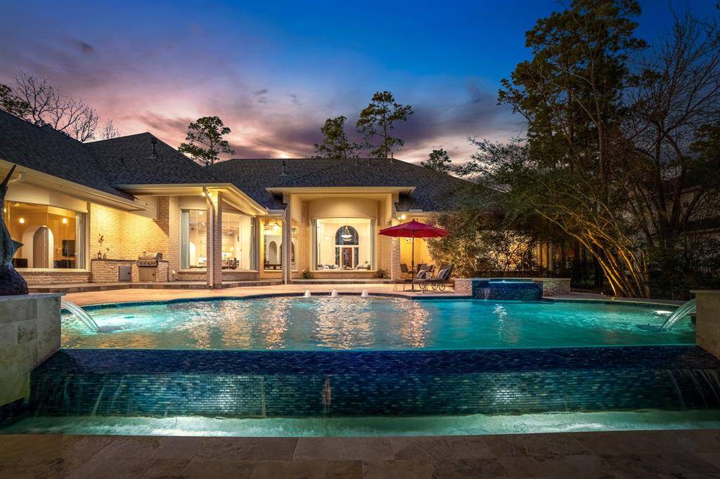 Enjoy the luxury of year-round outdoor living in this exquisite home.