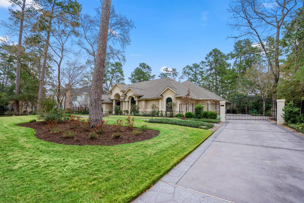 This stunning property is enclosed with wrought iron fencing and a remote-operated gate, for security and privacy. The motor court and four-car garage are perfect for auto enthusiasts. The smooth operation garage doors can be controlled by an app, allowing you to check that the doors are closed as you leave.