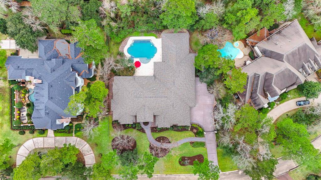 Aerial view showcasing the privacy and thoughtfully planned location of the home on the lot, providing a secluded and serene environment.