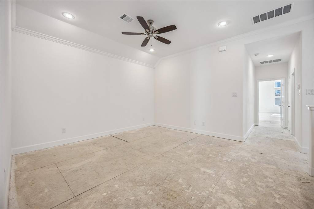 Entertainer's Nook: This game room is perfectly appointed with built-in shelves to showcase your interests and a ceiling fan above to ensure a cool, inviting atmosphere for every play.