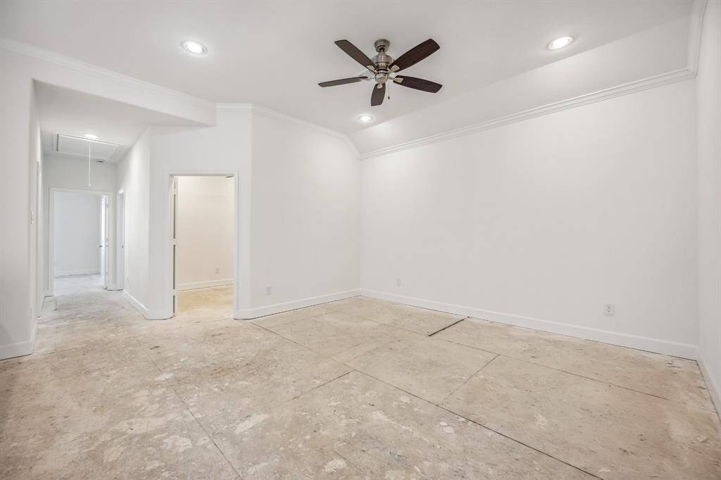 Leisure Loft: Discover a radiant game room, bathed in light, with the perfect blend of leisure and productivity just steps away in the adjacent study.