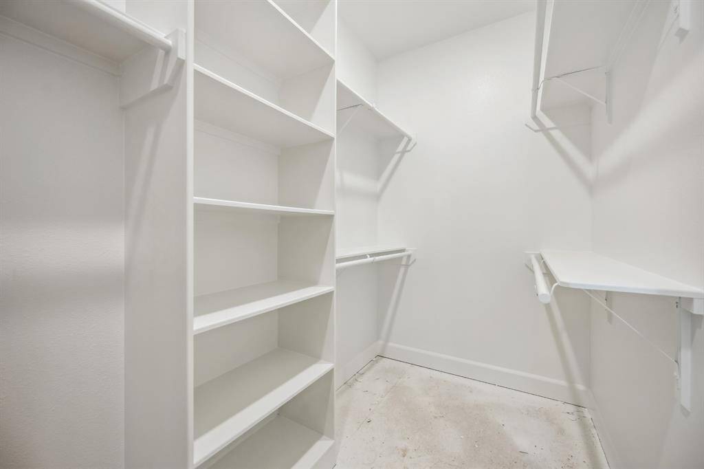Walk-In Closet Bliss: A generously sized walk-in closet with custom shelving and hanging space, perfect for effortless organization.