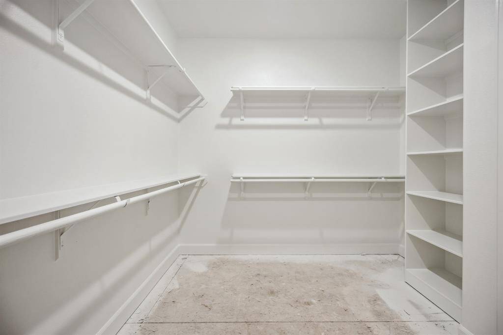 Expansive Closet: A large walk-in closet with dual hanging spaces, offering ample room for every season’s wardrobe.