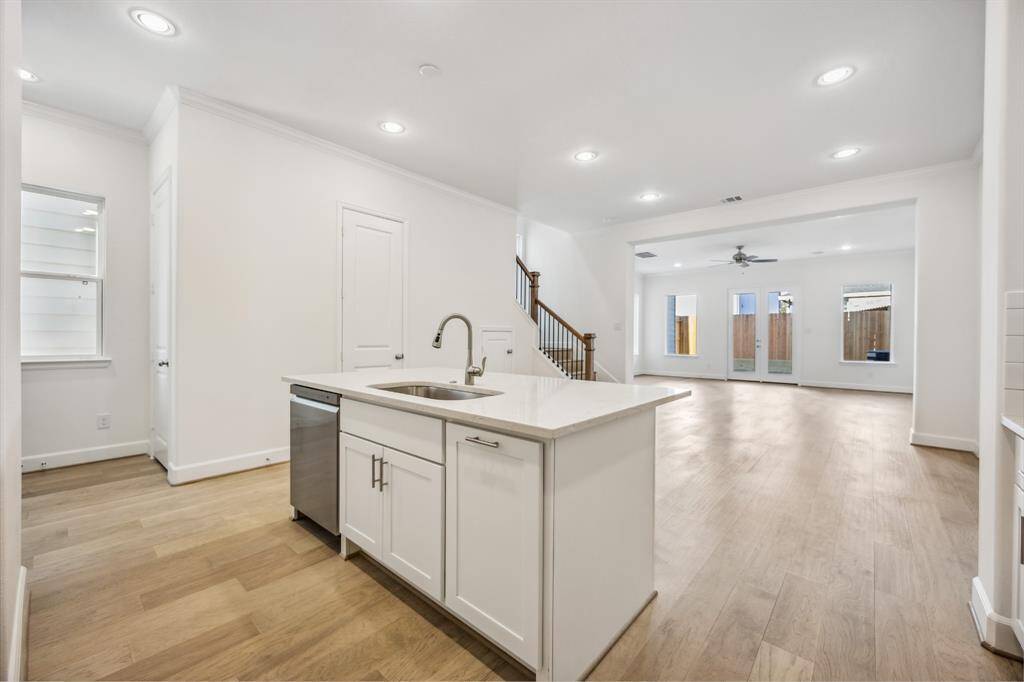 Sophistication Redefined: The kitchen's centerpiece—an elegant island—awaits the glow of your chosen pendant lights, making every moment in the heart of the home shine brighter.