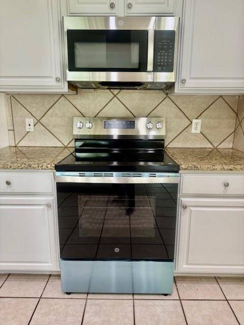 New cooking range and microwave. protected film to be removed by new buyer.