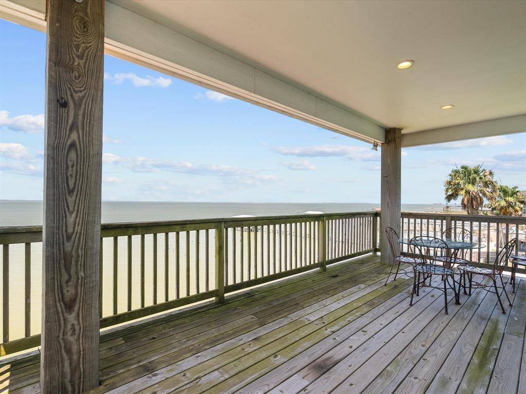Spacious covered deck with stunning ocean views. Ideal for enjoying sunsets and coastal breezes.