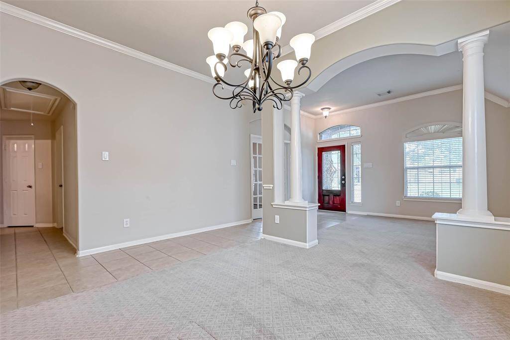 Looking from the Dining Room to the Living Room and the tiled Entry.