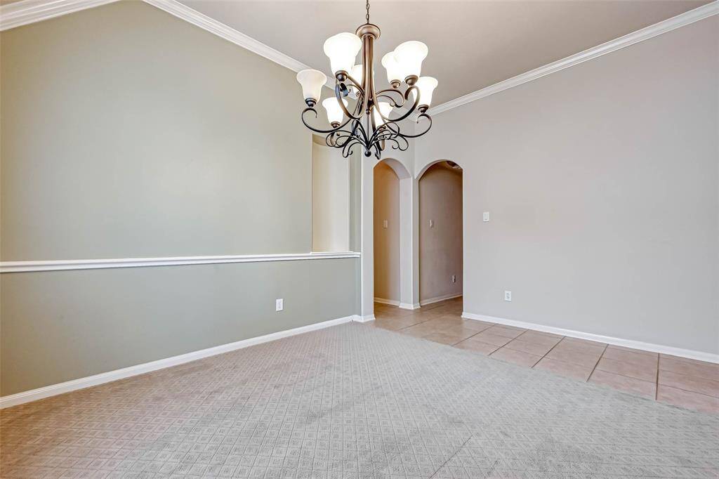 Dining Room looking toward the tiled Entry and the hallway to two other bedrooms.