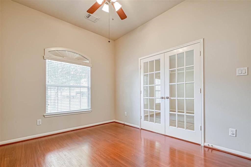 Bedroom #4/Study/home office has wood floor.