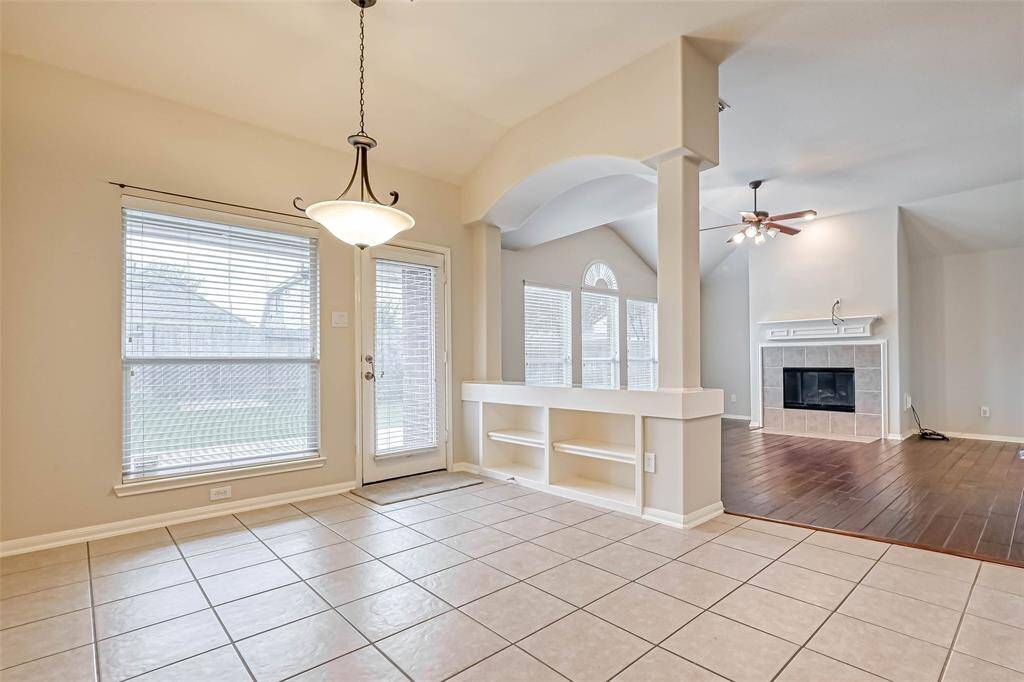Tiled Breakfast Room features shelving hat divides it from the Family Room.