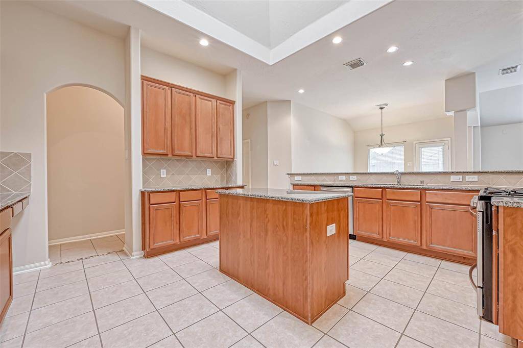 Large Kitchen features an island cabinet.
