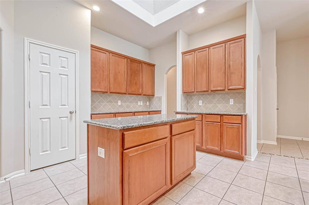 Looking across the island to the pantry on the left