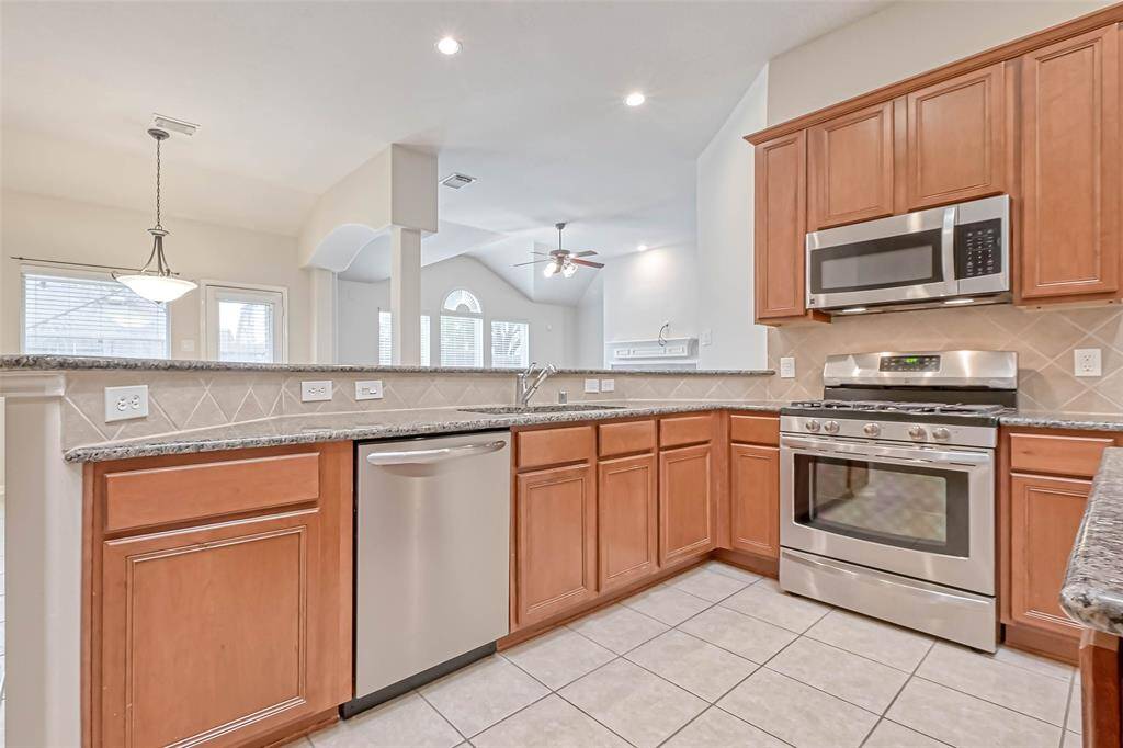 A workable kitchen with plenty of storage space.