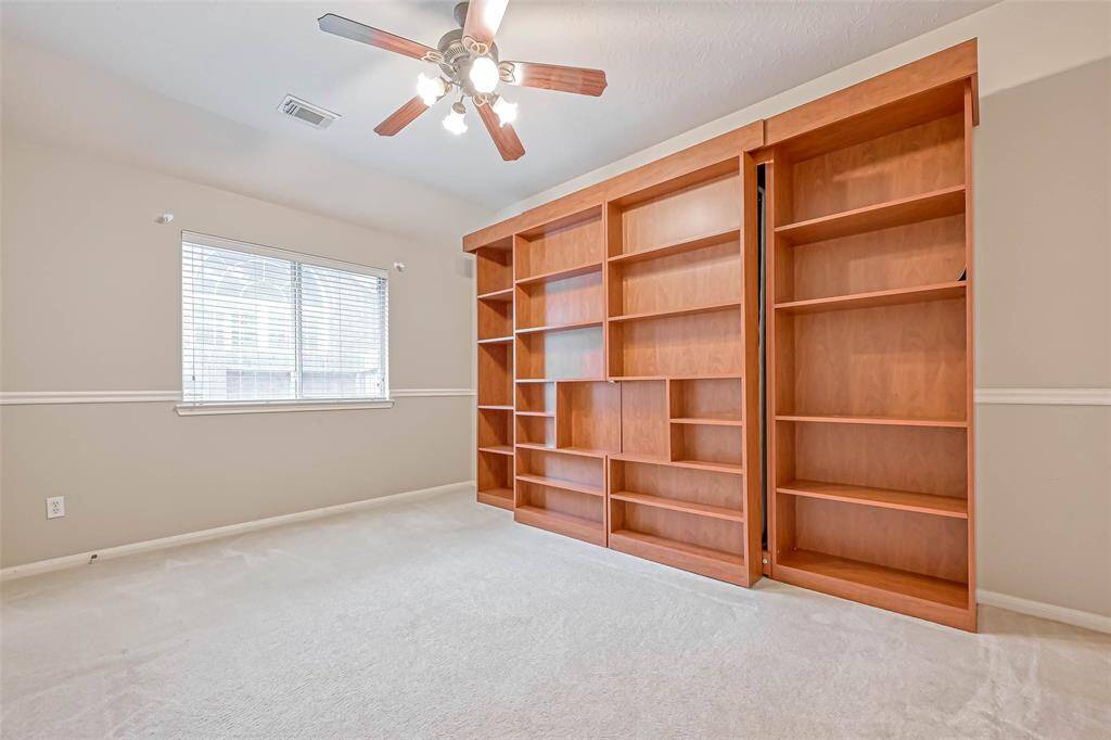 Bedroom #2 features a Murphy bed and shelving