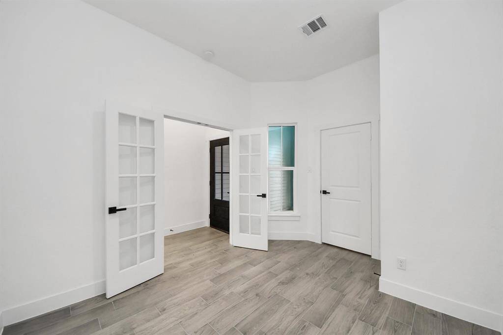 The office space can double as a fourth bedroom, because it still offers a closet, ceiling fan, and lovely window for plenty of natural light!