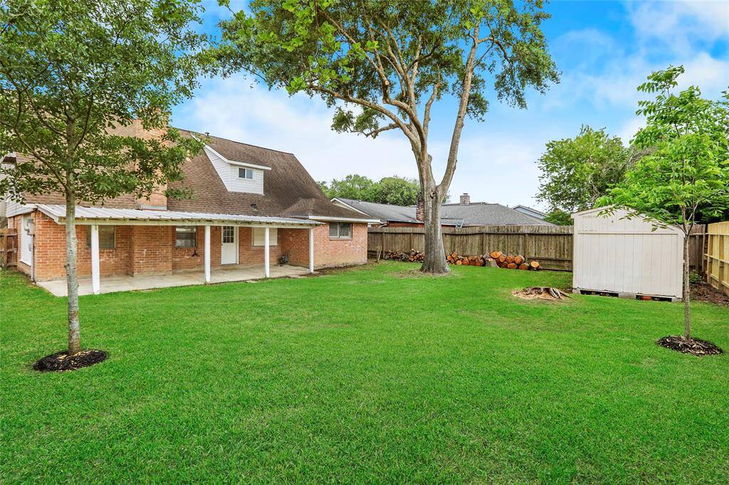 Patio for entertaining with mature shade tree
