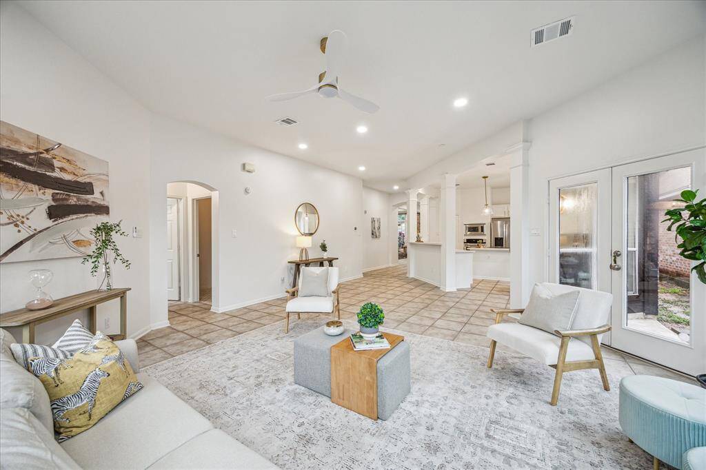 View of the family room into the kitchen.  Primary bedroom entry is on the left.
